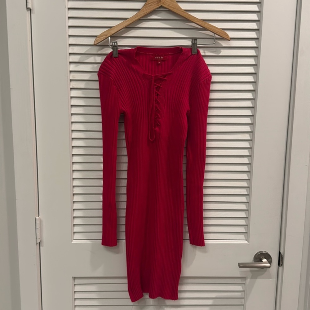 It’s a stretchable guess dress. It’s a hot Pink color and it’s size M-L